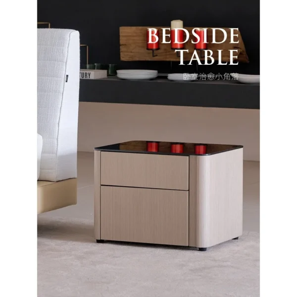 Rounded Oak Nightstand with Black Glass Top in natural oak — in a room setting