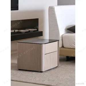 Rounded Oak Nightstand with Black Glass Top in natural oak — in a room setting