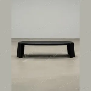 Jackfruit Wood Curved Coffee Table in Charred Black — in a room setting
