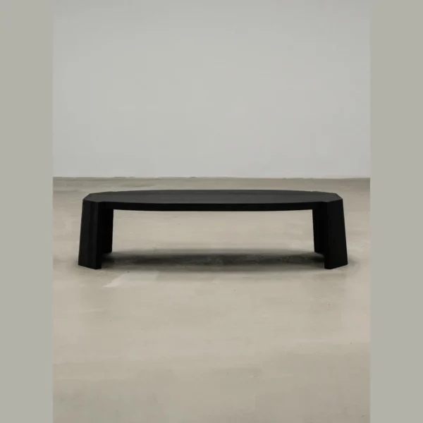 Jackfruit Wood Curved Coffee Table in Charred Black — in a room setting