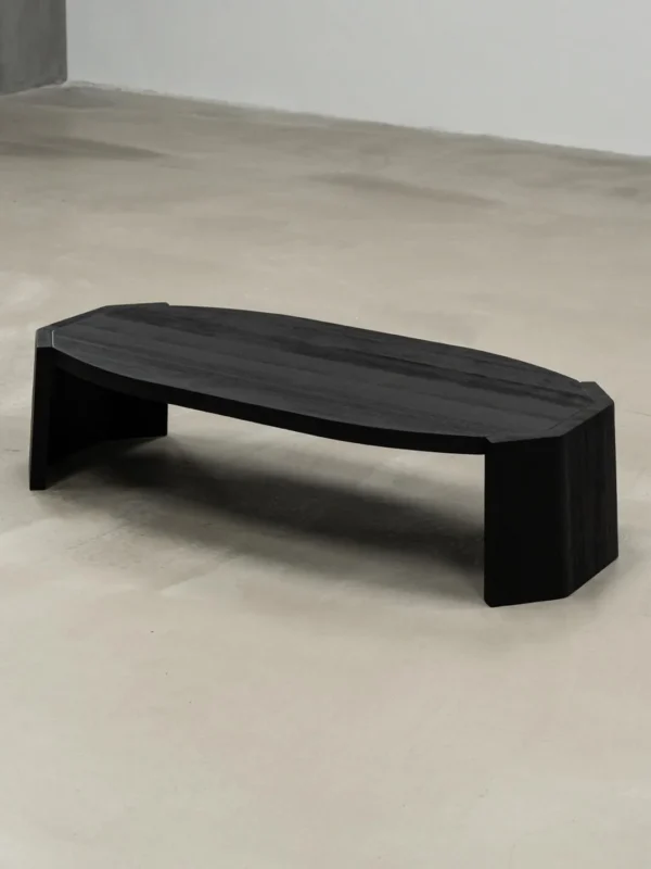 Jackfruit Wood Curved Coffee Table in Charred Black — in a room setting
