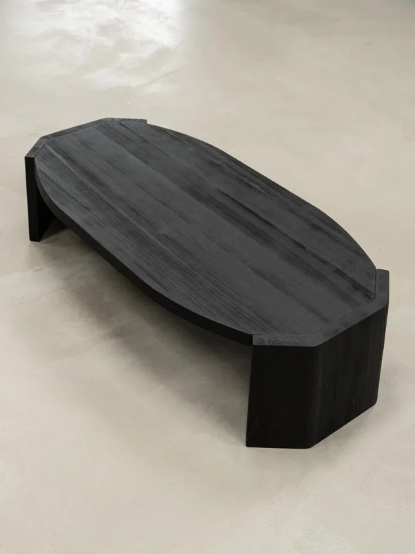 Jackfruit Wood Curved Coffee Table in Charred Black — in a room setting