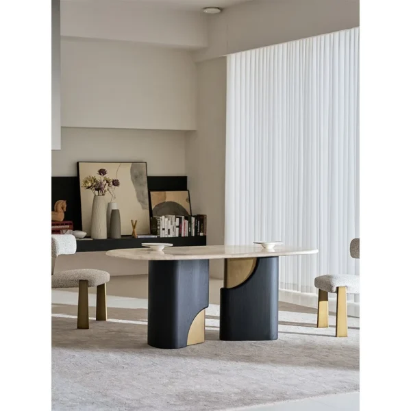 Jade Rabbit Travertine Oval Dining Table on Black Wood Legs in oatmeal — in a room setting
