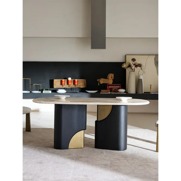 Jade Rabbit Travertine Oval Dining Table on Black Wood Legs in oatmeal — in a room setting