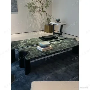 Jasper Long Green Marble Coffee Table on Black Wood Legs in olive — in a room setting