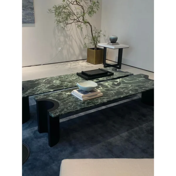 Jasper Long Green Marble Coffee Table on Black Wood Legs in olive — in a room setting