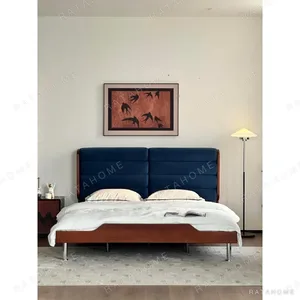 Blue Swirl Curved-Headboard Bed with Boxwood Base in blue — in a room setting