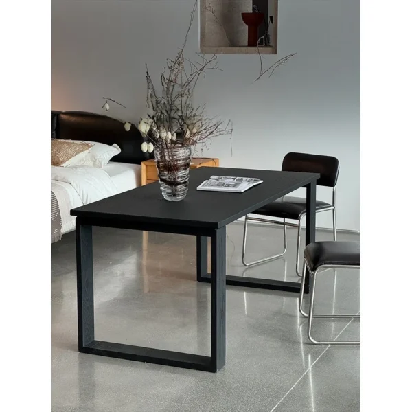 Fangshuo Carbonised Ash Dining Table with Square Frame Legs in black — in a room setting