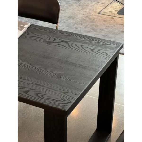 Fangshuo Carbonised Ash Dining Table with Square Frame Legs in black — in a room setting