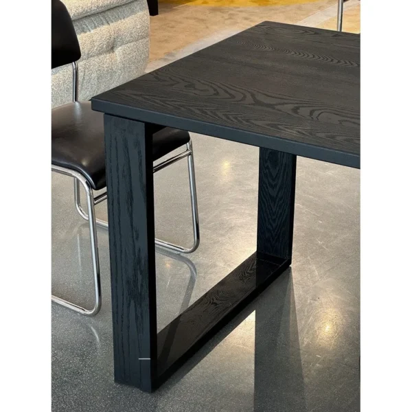 Fangshuo Carbonised Ash Dining Table with Square Frame Legs in black — in a room setting