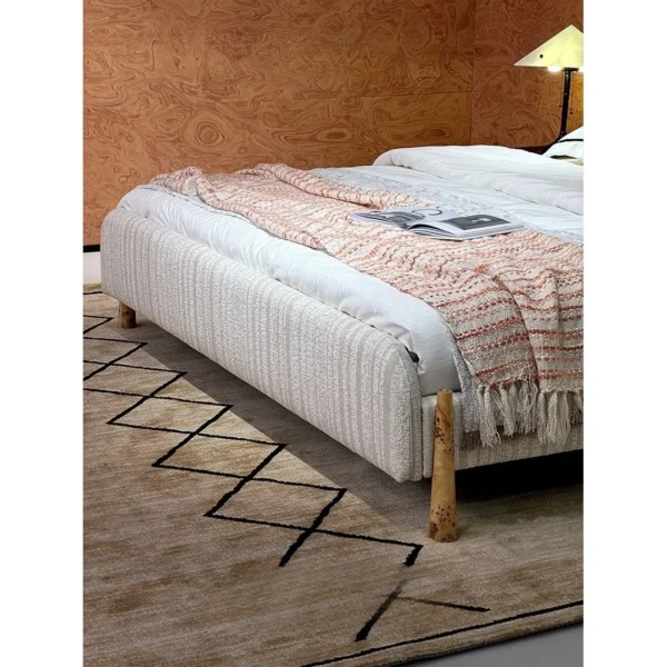 First Snow Ribbed Fabric Bed with Wood Trim in ivory — in a room setting