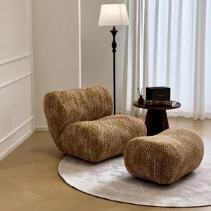 Hebe Curved Bouclé Lounge Chair with Ottoman in Amber Tweed — front view