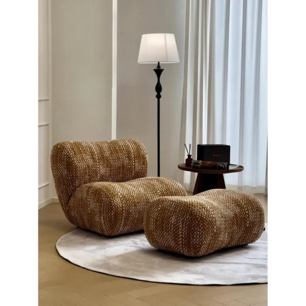 Hebe Curved Bouclé Lounge Chair with Ottoman in Amber Tweed — in a room setting