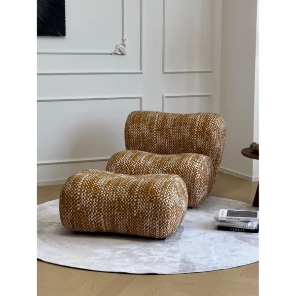 Hebe Curved Bouclé Lounge Chair with Ottoman in Amber Tweed — in a room setting