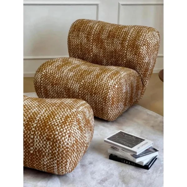 Hebe Curved Bouclé Lounge Chair with Ottoman in Amber Tweed — in a room setting