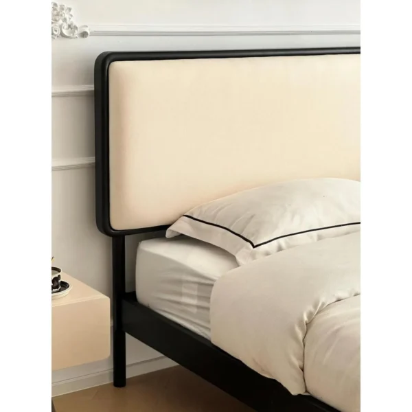 Jianxu Slim Black-Frame Bed with Linen Headboard in black — in a room setting