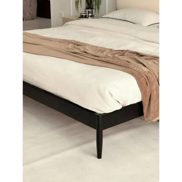 Jianxu Slim Black-Frame Bed with Linen Headboard in black — in a room setting