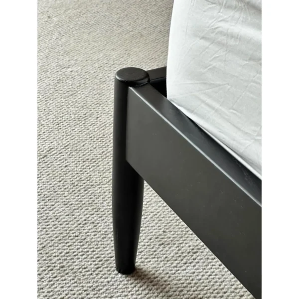 Jianxu Slim Black Beech Bed in black — in a room setting