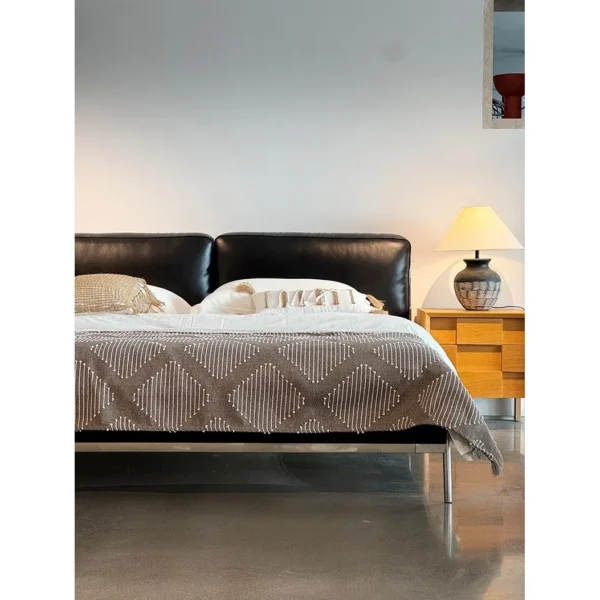 Lengxu Black Leather Bed with Chrome Frame in black — in a room setting