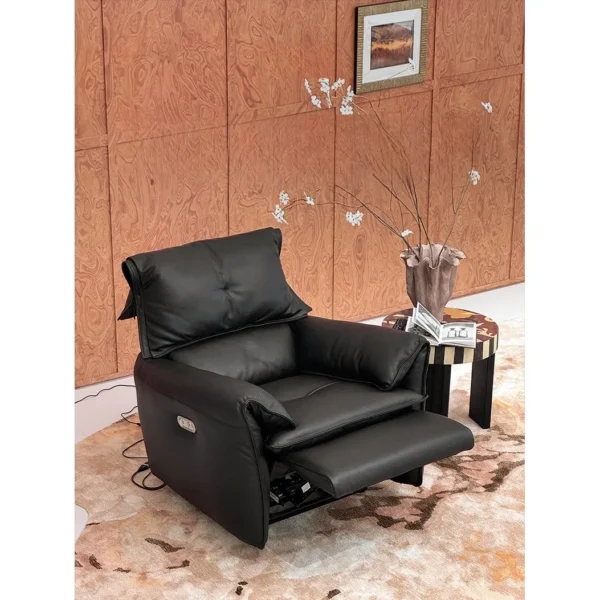 Matte Black Leather Electric Recliner with Rocking and USB in black — in a room setting