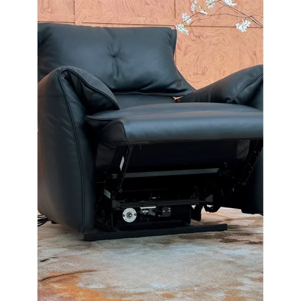 Matte Black Leather Electric Recliner with Rocking and USB in black — in a room setting