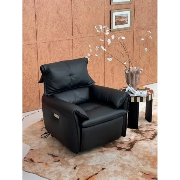 Matte Black Leather Electric Recliner with Rocking and USB in black — in a room setting