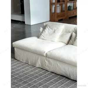 Skirt Sofa in White Linen with Removable Draped Cover — in a room setting