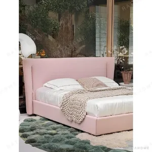 Soft Arc Pink Upholstered Bed in rose stone — in a room setting