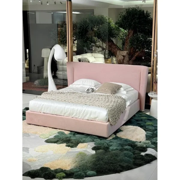 Soft Arc Pink Upholstered Bed in rose stone — in a room setting