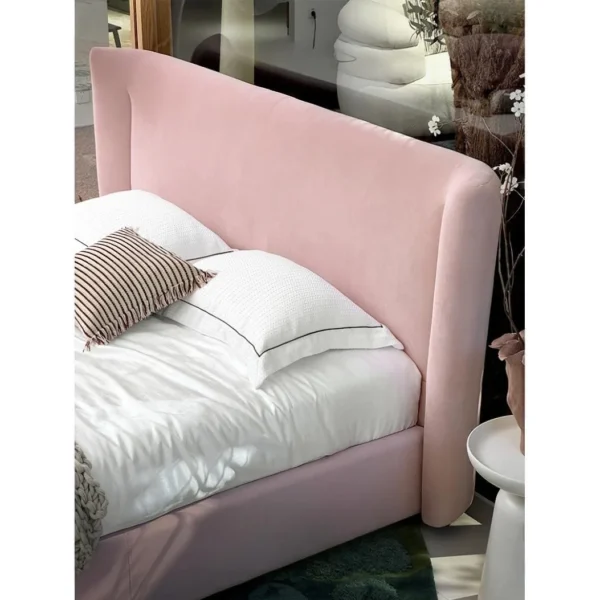 Soft Arc Pink Upholstered Bed in rose stone — in a room setting