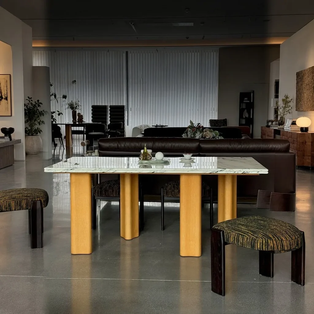 Spruce Cloud Marble Dining Table on Ash Posts in ivory — front view