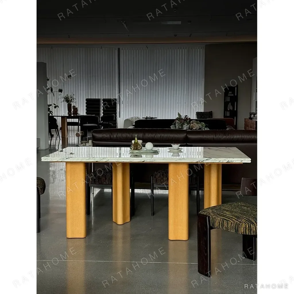 Spruce Cloud Marble Dining Table on Ash Posts in ivory — in a room setting