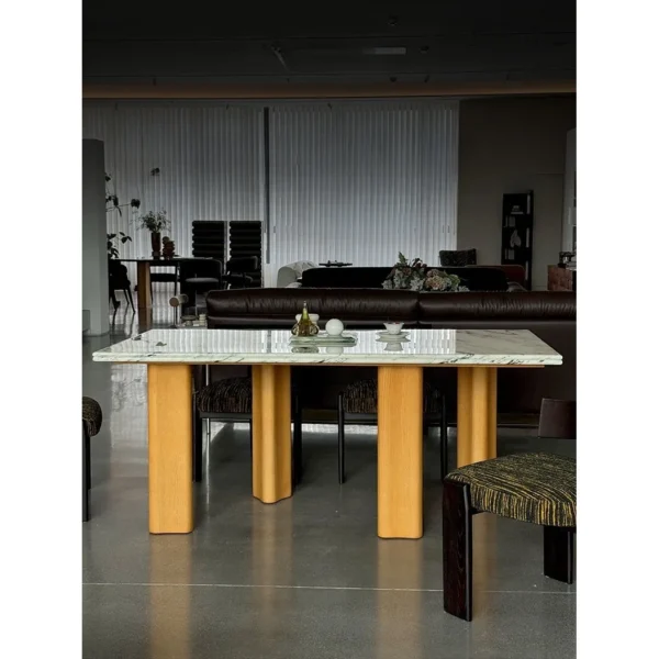 Spruce Cloud Marble Dining Table on Ash Posts in ivory — in a room setting