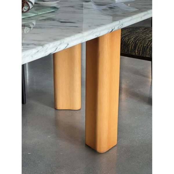 Spruce Cloud Marble Dining Table on Ash Posts in ivory — in a room setting
