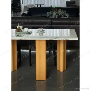 Spruce Cloud Marble Dining Table on Ash Posts in ivory — in a room setting