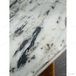 Spruce Cloud Marble Dining Table on Ash Posts in ivory — in a room setting
