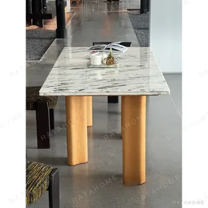Spruce Cloud Marble Dining Table on Ash Posts in ivory — in a room setting
