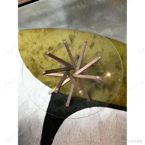 Star Round Glass Coffee Table on Splayed Wood Base, 100 cm in clay — in a room setting