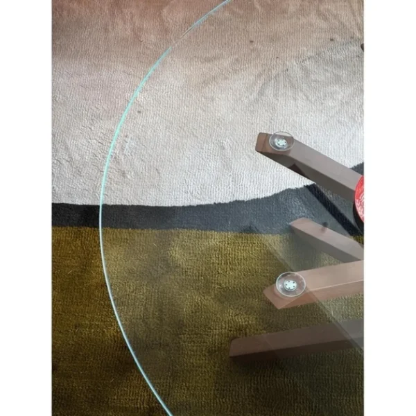Star Round Glass Coffee Table on Splayed Wood Base, 100 cm in clay — in a room setting