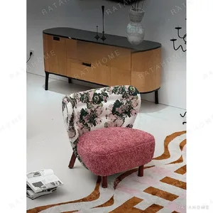 Woolf Rose Jacquard Lounge Chair with Pink Velvet Seat in rose stone — in a room setting