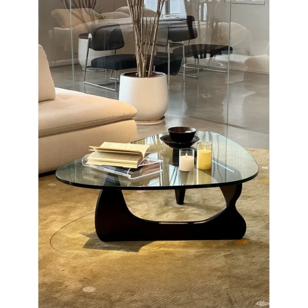 Yuji Triangle Glass Coffee Table in clay — in a room setting