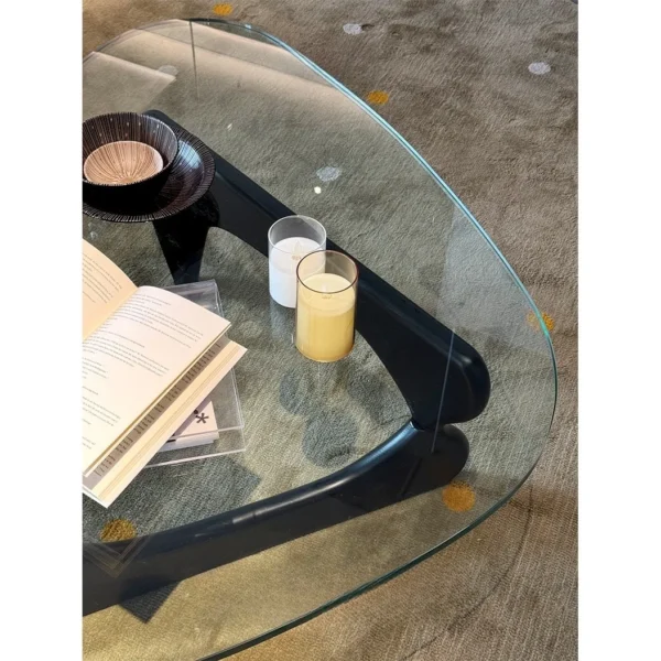 Yuji Triangle Glass Coffee Table in clay — in a room setting