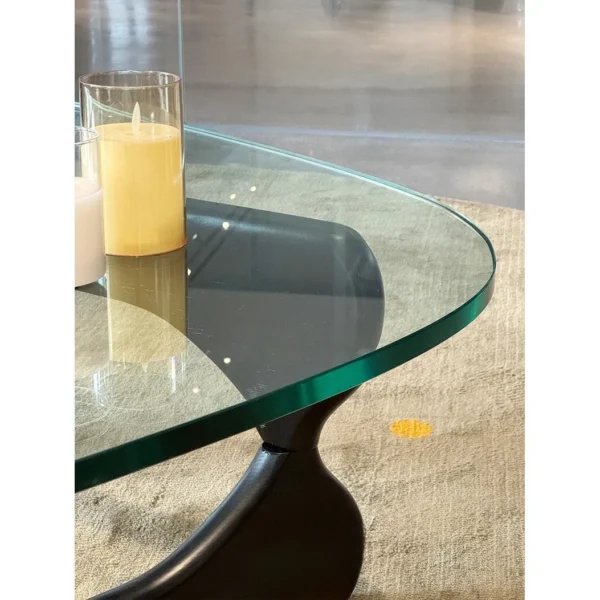 Yuji Triangle Glass Coffee Table in clay — in a room setting