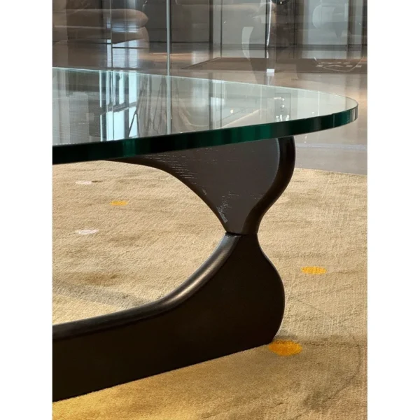 Yuji Triangle Glass Coffee Table in clay — in a room setting