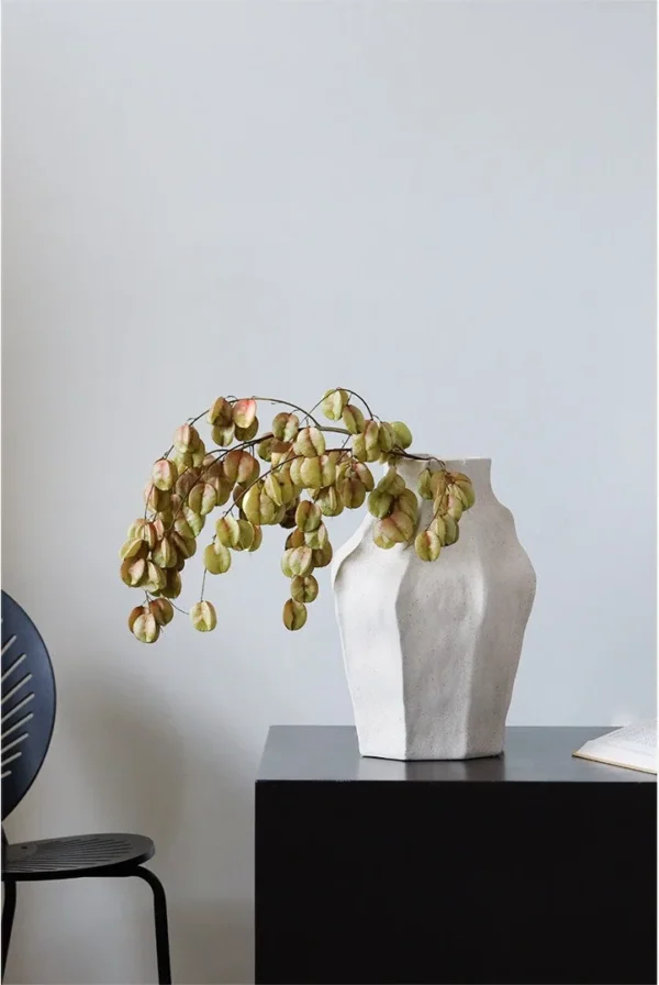 Jingdezhen Faceted Sand-Texture Art Vessel, Short or Tall in ivory — in a room setting
