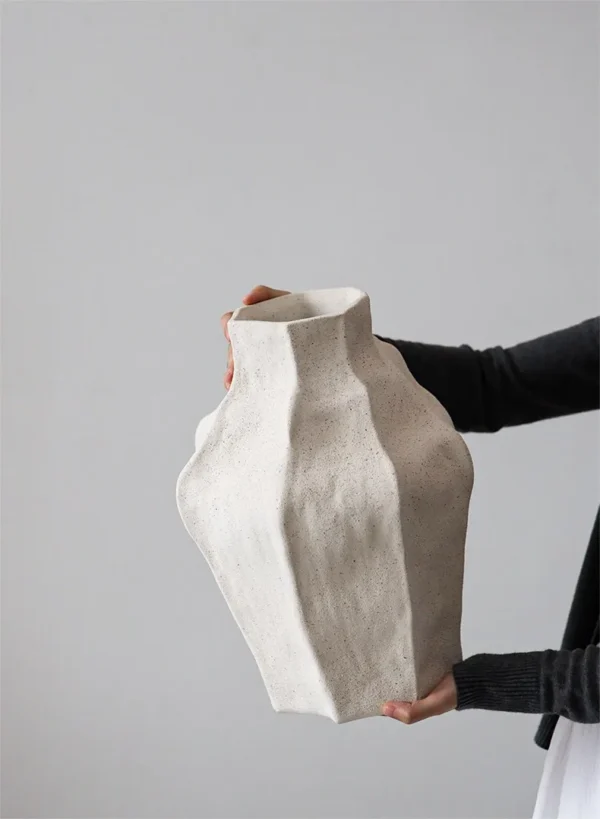 Jingdezhen Faceted Sand-Texture Art Vessel, Short or Tall in ivory — in a room setting