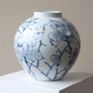 Hand-Painted Blue and White Orchid Round Jar in blue — front view