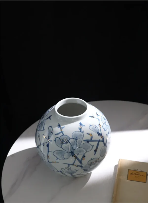 Hand-Painted Blue and White Orchid Round Jar in blue — in a room setting
