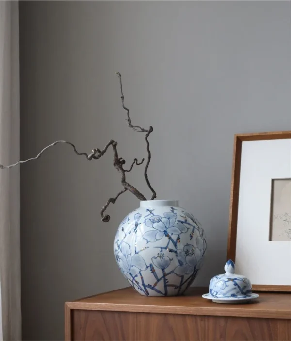 Hand-Painted Blue and White Orchid Round Jar in blue — in a room setting
