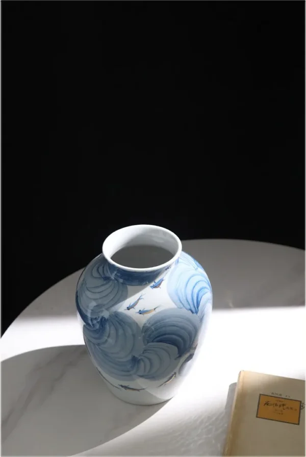Hand-Painted Blue Wave Flat-Base Jar with Gold Fish, Large in blue — in a room setting